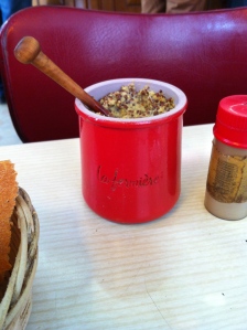 Perhaps the best recycling: ceramic yogurt jar finds a second calling as a mustard-holder. 